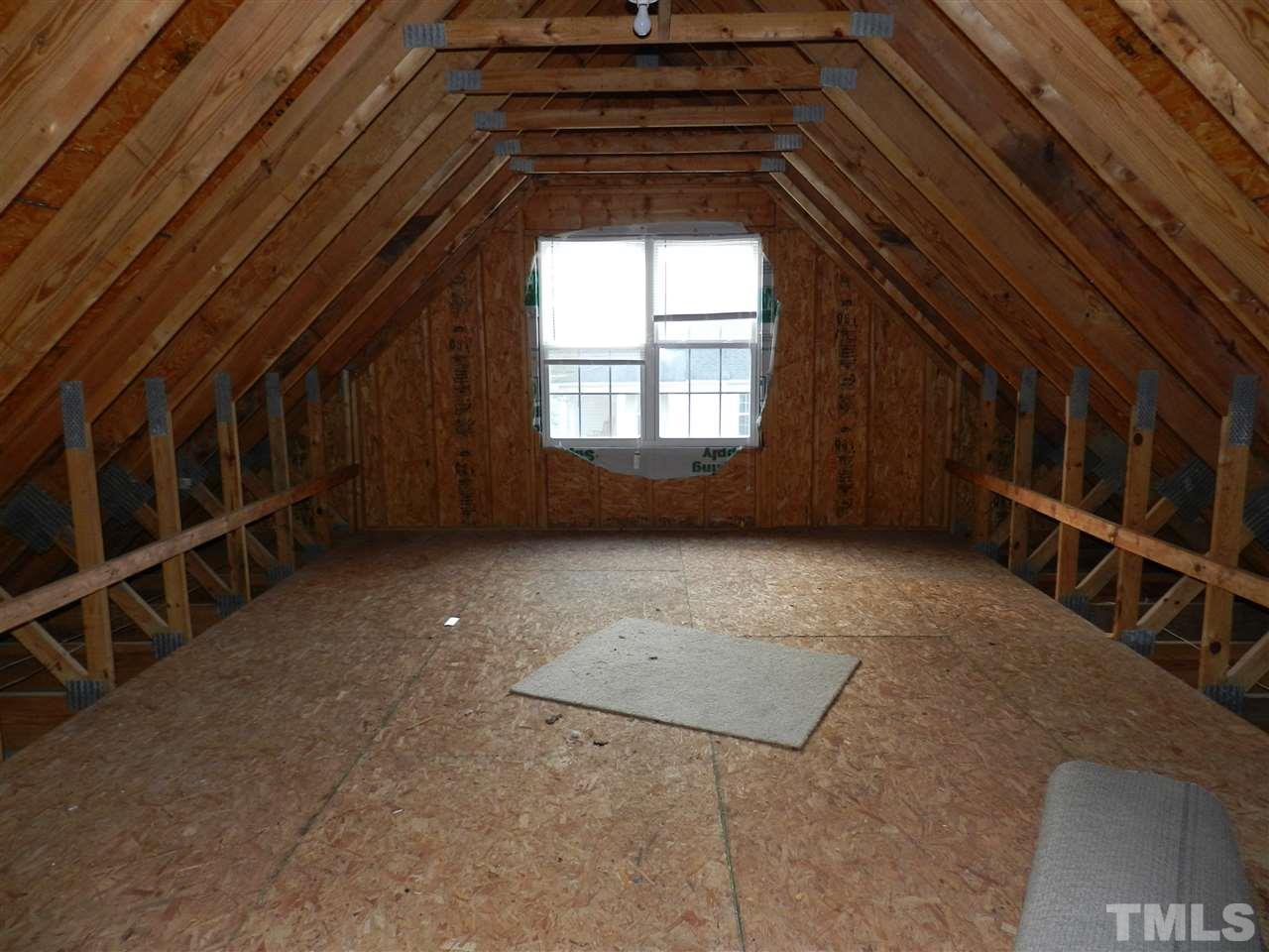 453 Axum Road Willow Spring, NC 27592 - Photo 15 of 17 a view of an empty room with a window