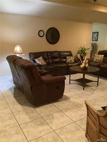 a living room with couch and a table