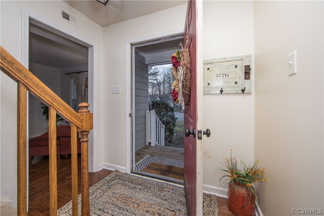 13810 Laurel Spring Road Chester, VA 23831 - Photo 28 of 28 a view of a hallway with paintings on the wall
