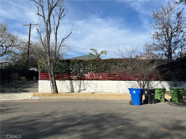a view of the house with snow on the road