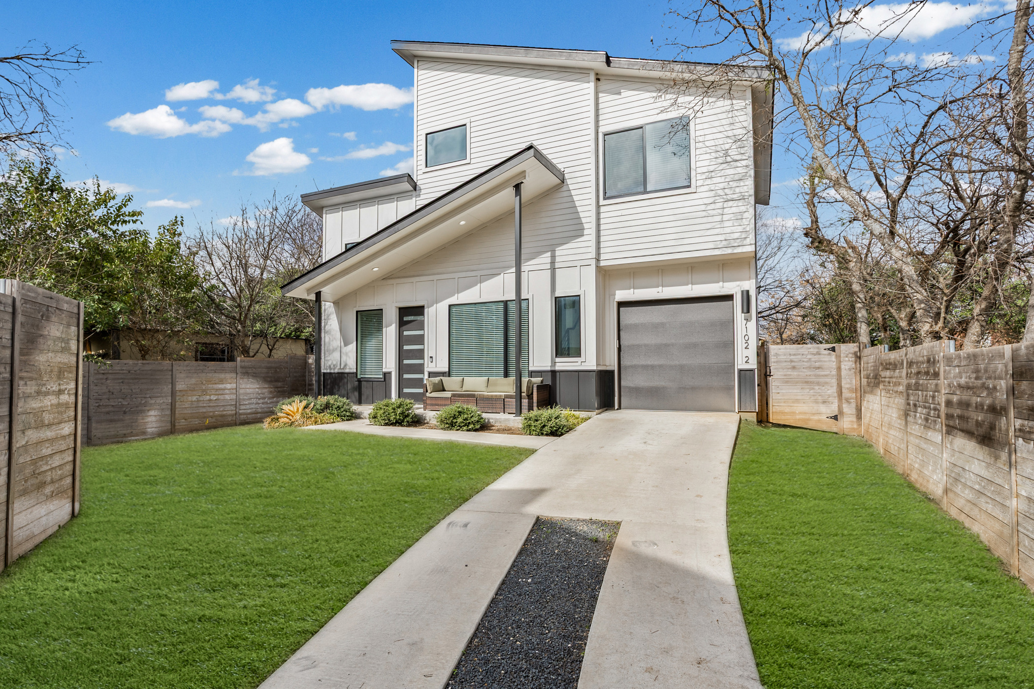 7102 Providence Avenue, Unit 2 Austin, TX 78752 - Photo 1 of 22 a front view of house with yard and green space