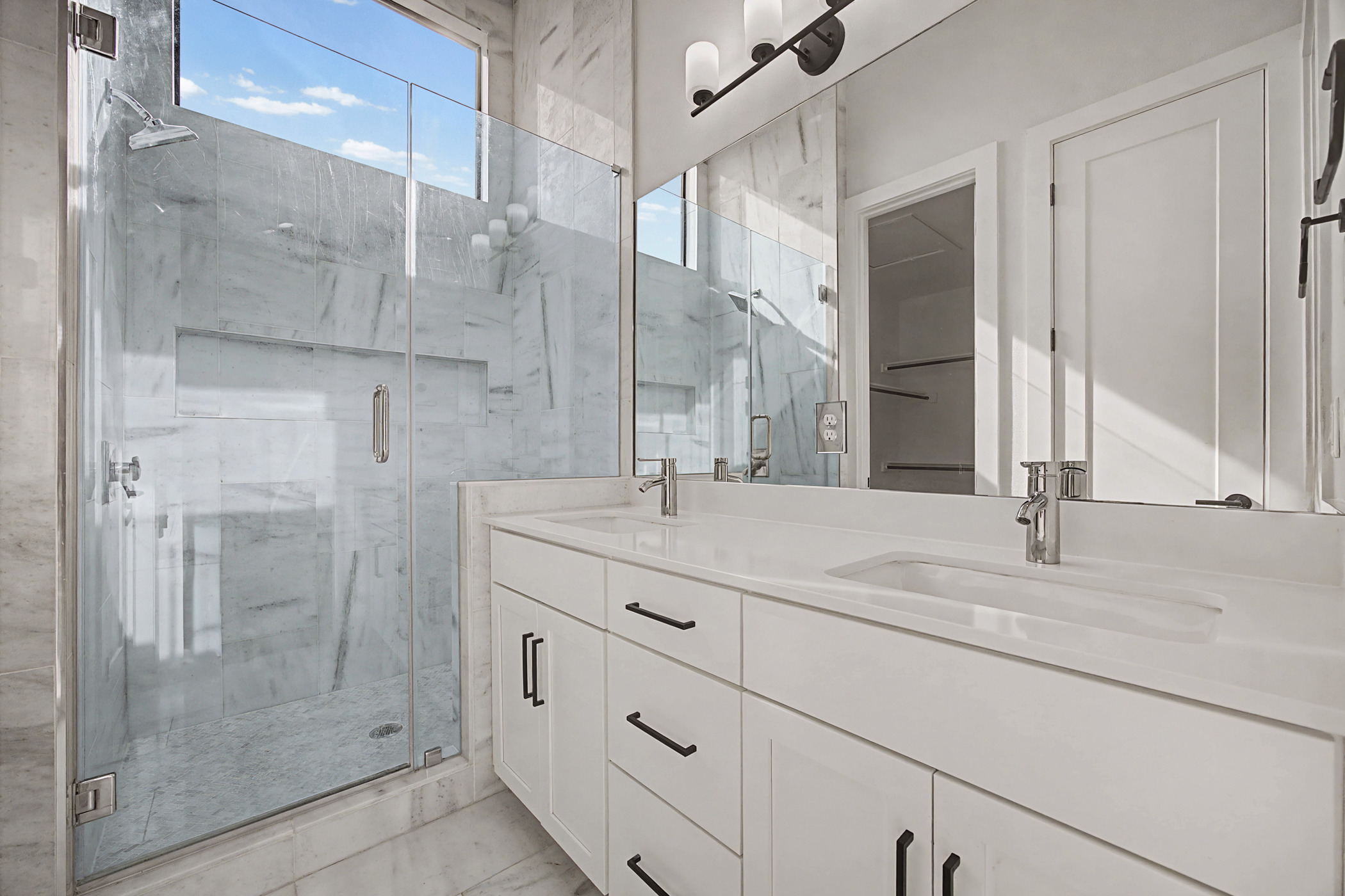 7102 Providence Avenue, Unit 2 Austin, TX 78752 - Photo 13 of 22 a bathroom with a shower sink and mirror
