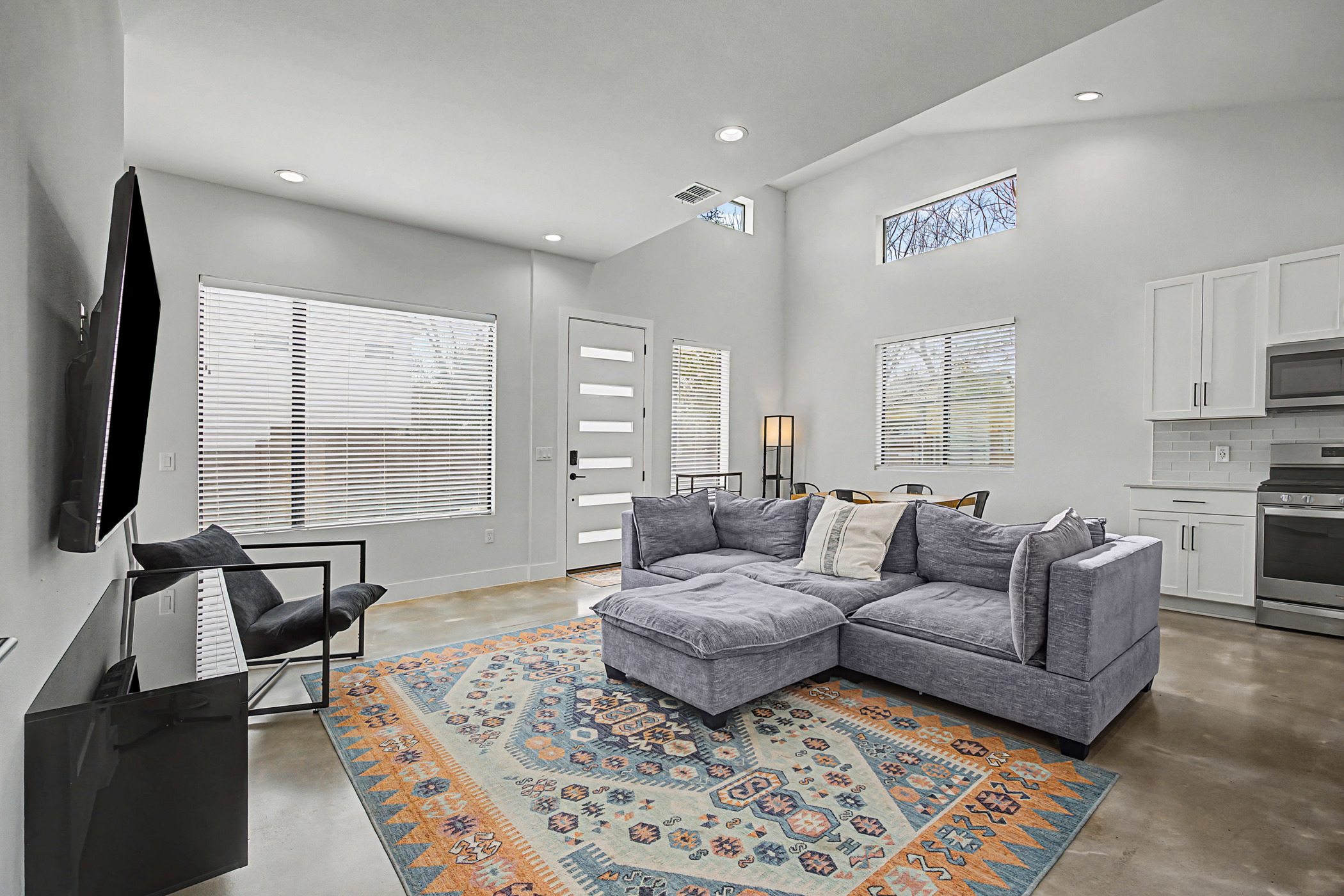 7102 Providence Avenue, Unit 2 Austin, TX 78752 - Photo 5 of 22 a living room with furniture and a flat screen tv