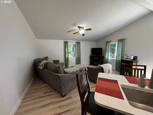 a living room with furniture fireplace and a flat screen tv