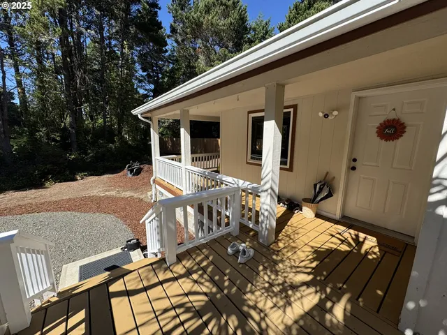 a view of balcony with wooden floor and outdoor seating