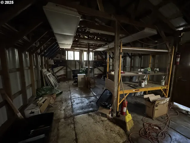 a view of a patio with table and chairs a barbeque