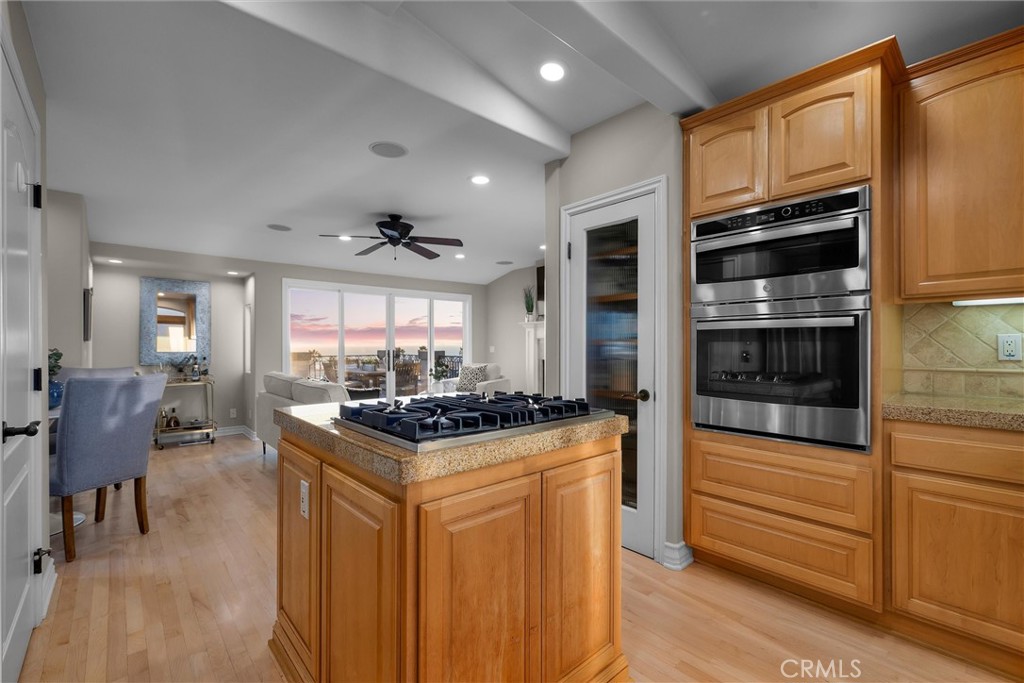 1042 Bayview Drive Hermosa Beach, CA 90254 - Photo 14 of 44 a kitchen with stainless steel appliances granite countertop a stove and a refrigerator