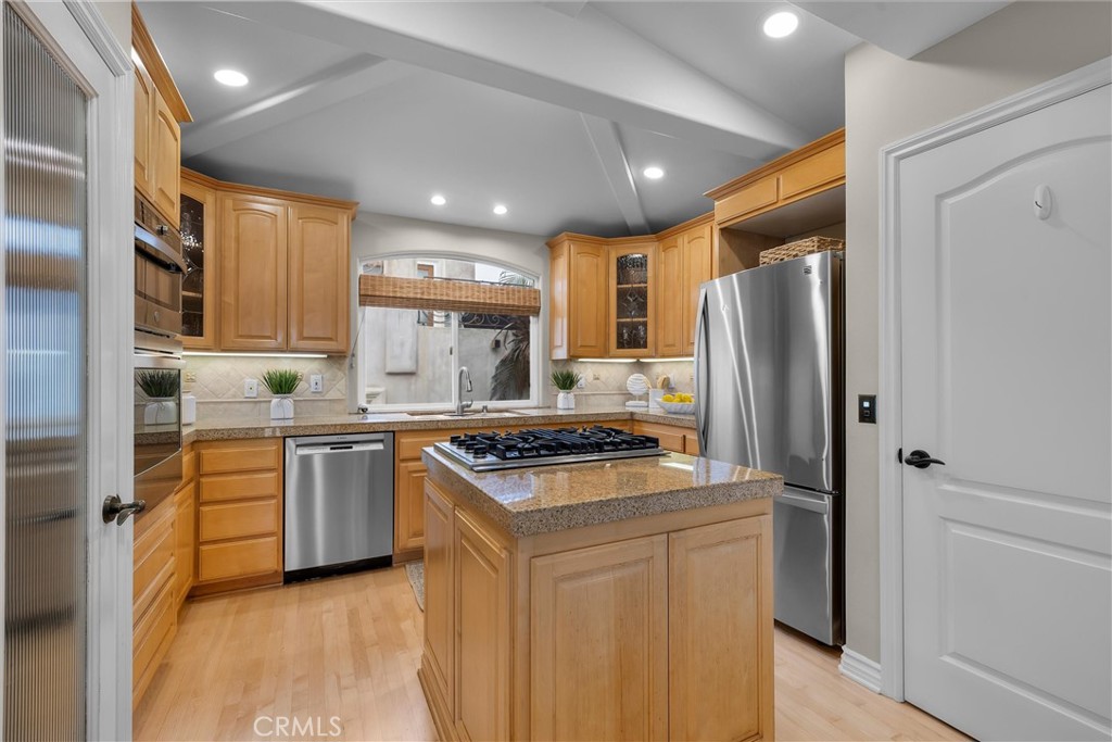 1042 Bayview Drive Hermosa Beach, CA 90254 - Photo 16 of 44 a kitchen with stainless steel appliances granite countertop a refrigerator and a stove