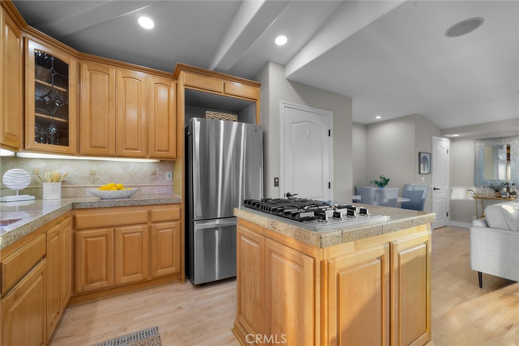 1042 Bayview Drive Hermosa Beach, CA 90254 - Photo 18 of 44 a kitchen with stainless steel appliances granite countertop a sink stove and refrigerator