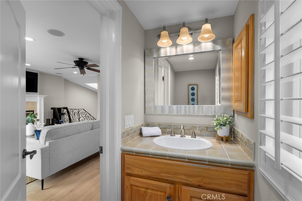 1042 Bayview Drive Hermosa Beach, CA 90254 - Photo 20 of 44 a en suite bathroom with a sink and a mirror