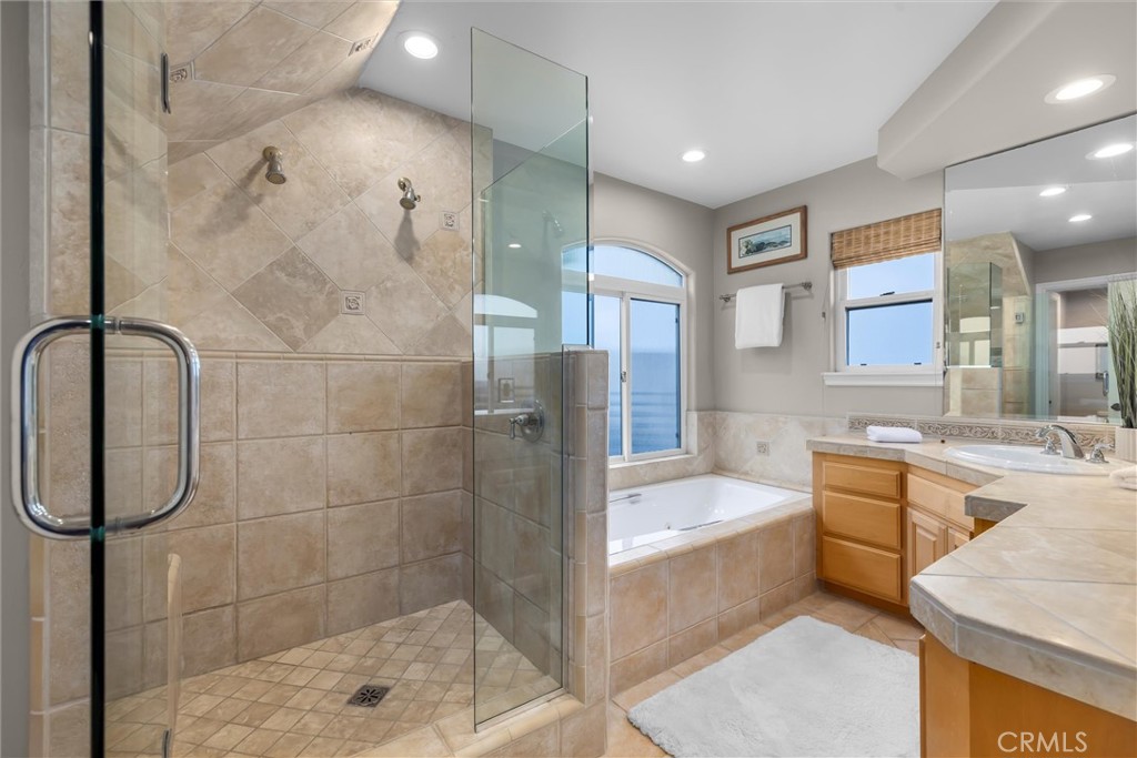 1042 Bayview Drive Hermosa Beach, CA 90254 - Photo 24 of 44 a bathroom with a tub sink and mirror
