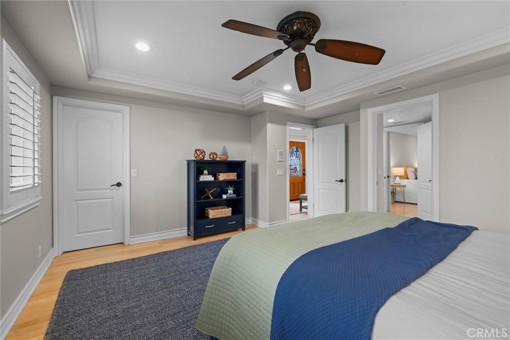 1042 Bayview Drive Hermosa Beach, CA 90254 - Photo 28 of 44 a bedroom with a bed and a chandelier