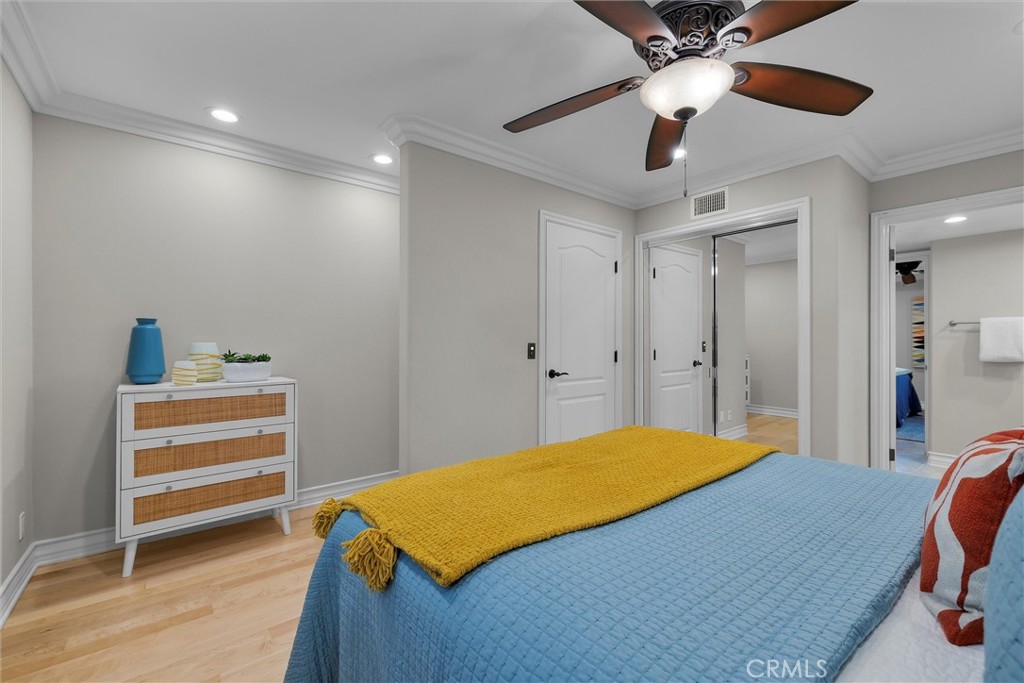 1042 Bayview Drive Hermosa Beach, CA 90254 - Photo 30 of 44 a bedroom with a bed and a chandelier