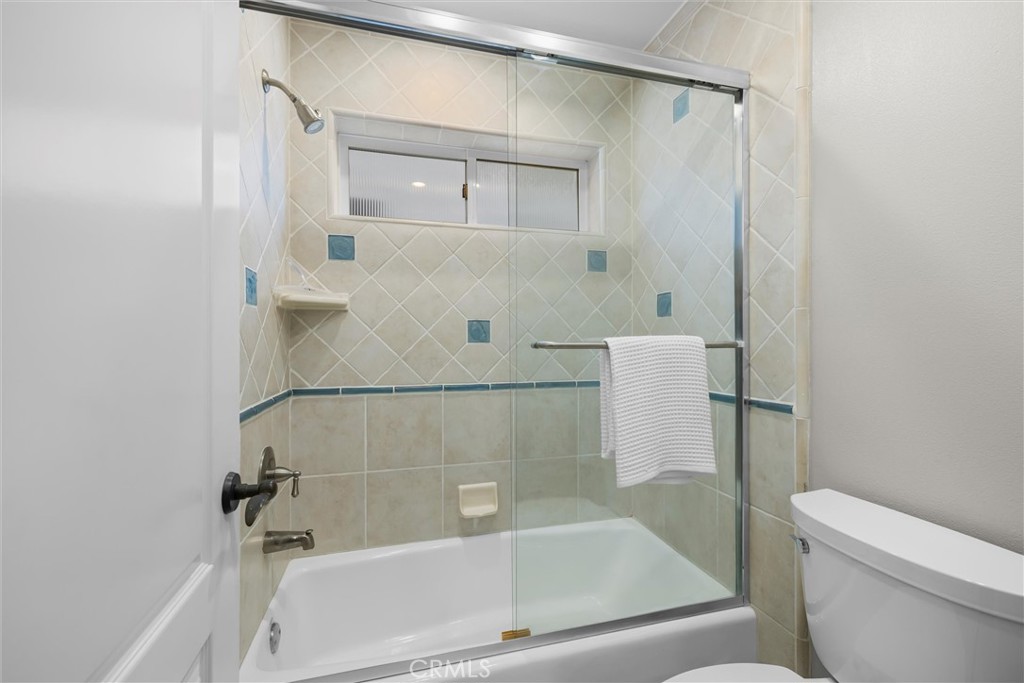 1042 Bayview Drive Hermosa Beach, CA 90254 - Photo 32 of 44 a bath tub sitting next to a white toilet and sink