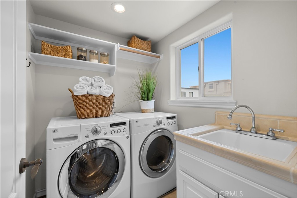 1042 Bayview Drive Hermosa Beach, CA 90254 - Photo 37 of 44 a bathroom with a sink and a mirror