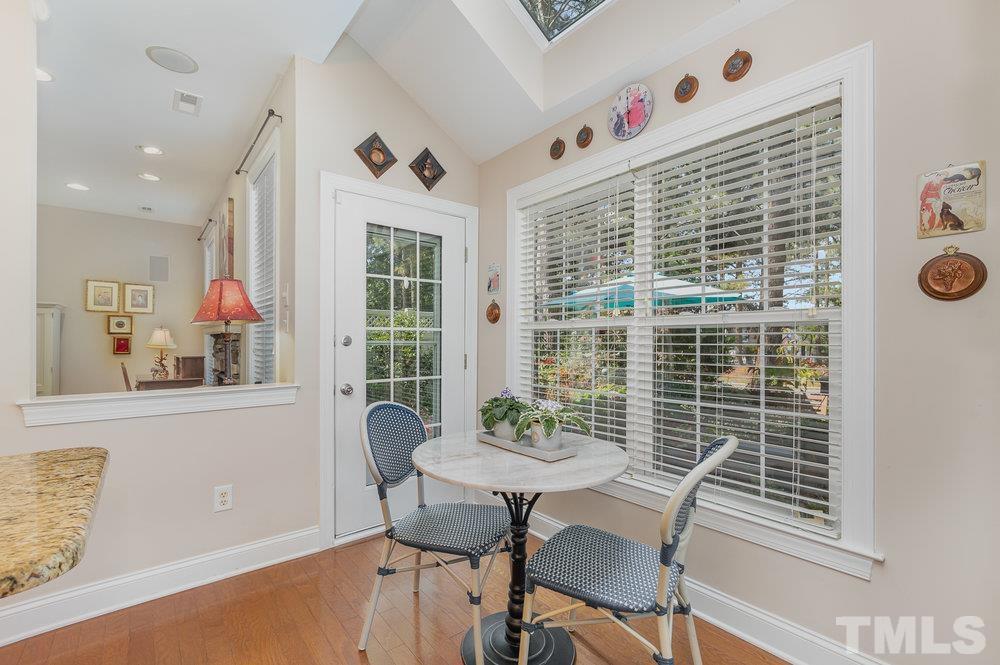 10122 Mizner Lane Raleigh, NC 27617 - Photo 13 of 31 a view of a dining room with furniture and window