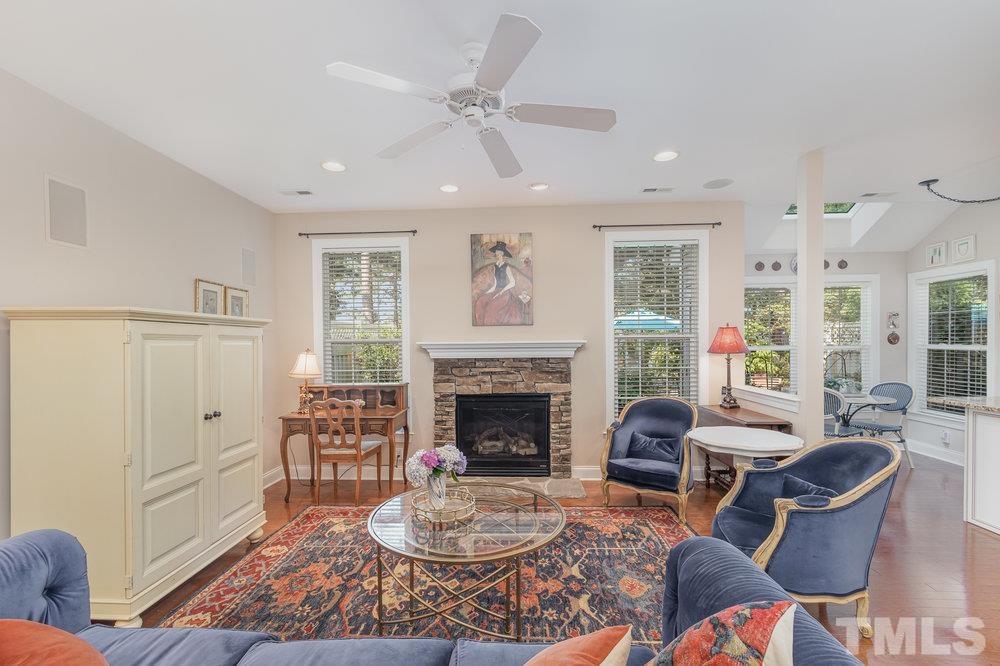 10122 Mizner Lane Raleigh, NC 27617 - Photo 15 of 31 a living room with furniture and a fireplace