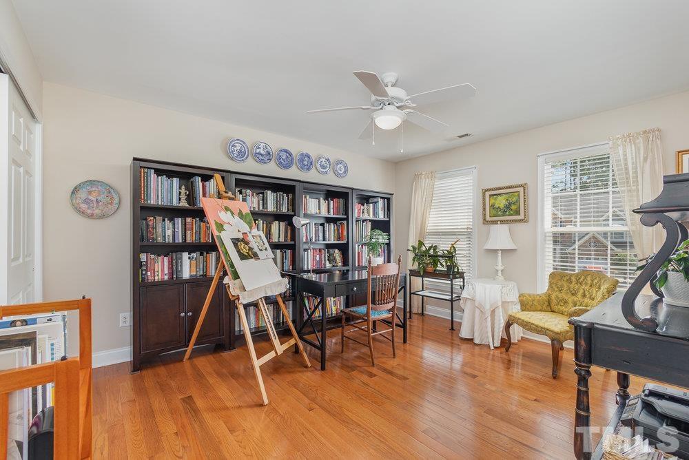 10122 Mizner Lane Raleigh, NC 27617 - Photo 21 of 31 a view of a livingroom with furniture and wooden floor