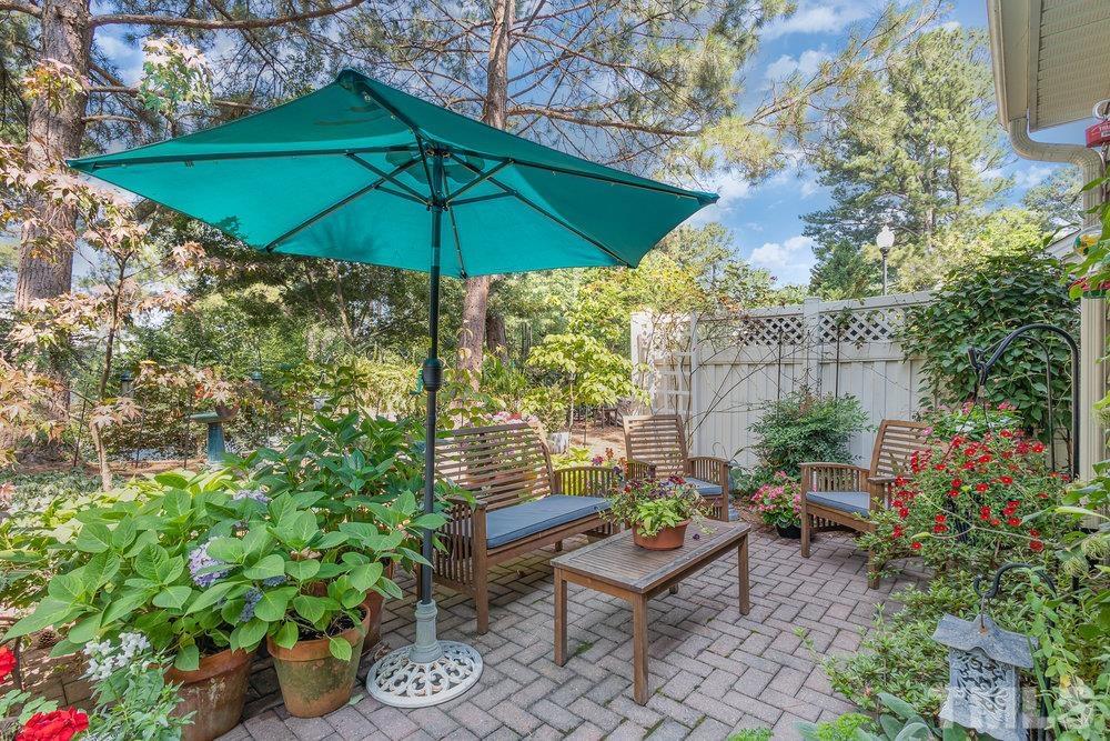10122 Mizner Lane Raleigh, NC 27617 - Photo 25 of 31 a view of garden with an outdoor seating