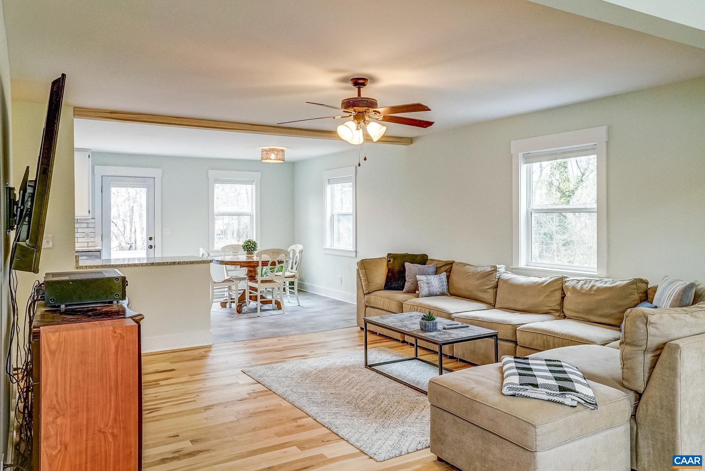1265 Pounding Creek Road Charlottesville, VA 22903 - Photo 15 of 71 a living room with furniture and a wooden floor