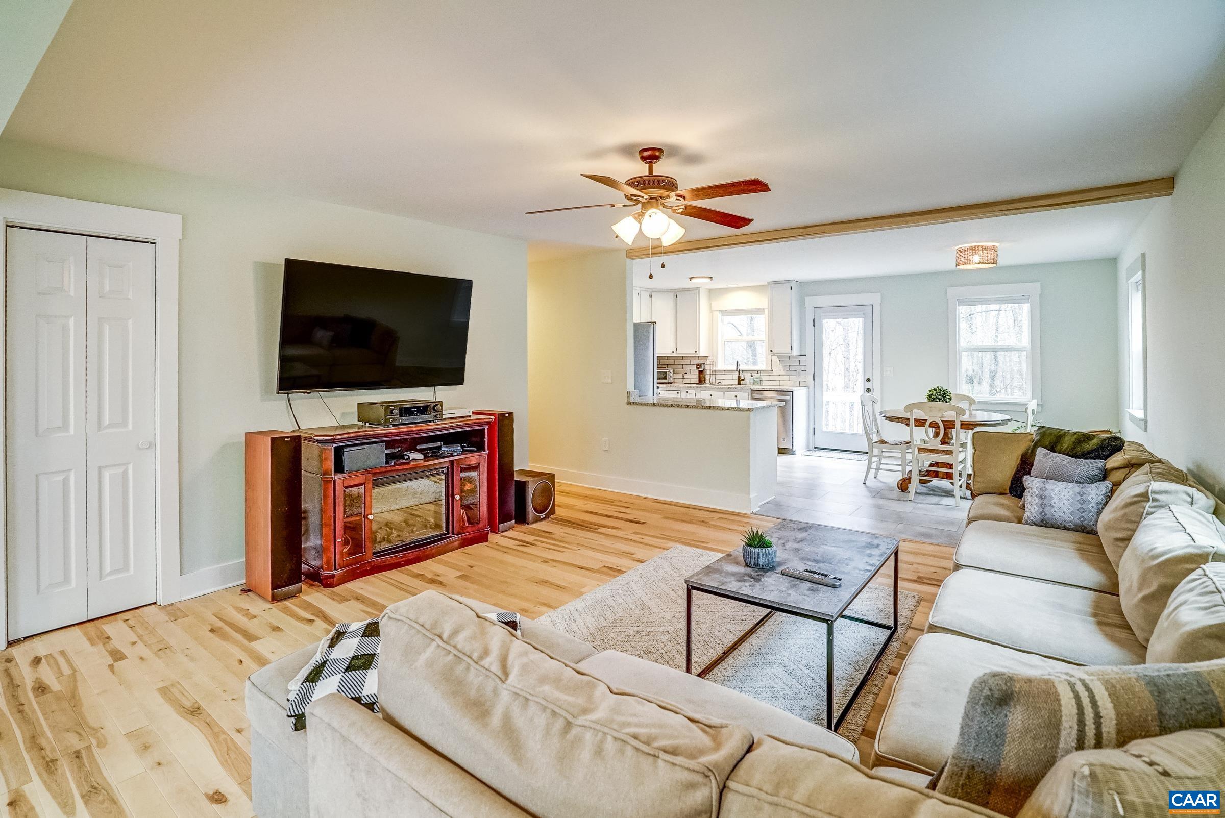 1265 Pounding Creek Road Charlottesville, VA 22903 - Photo 16 of 71 a living room with furniture and a flat screen tv