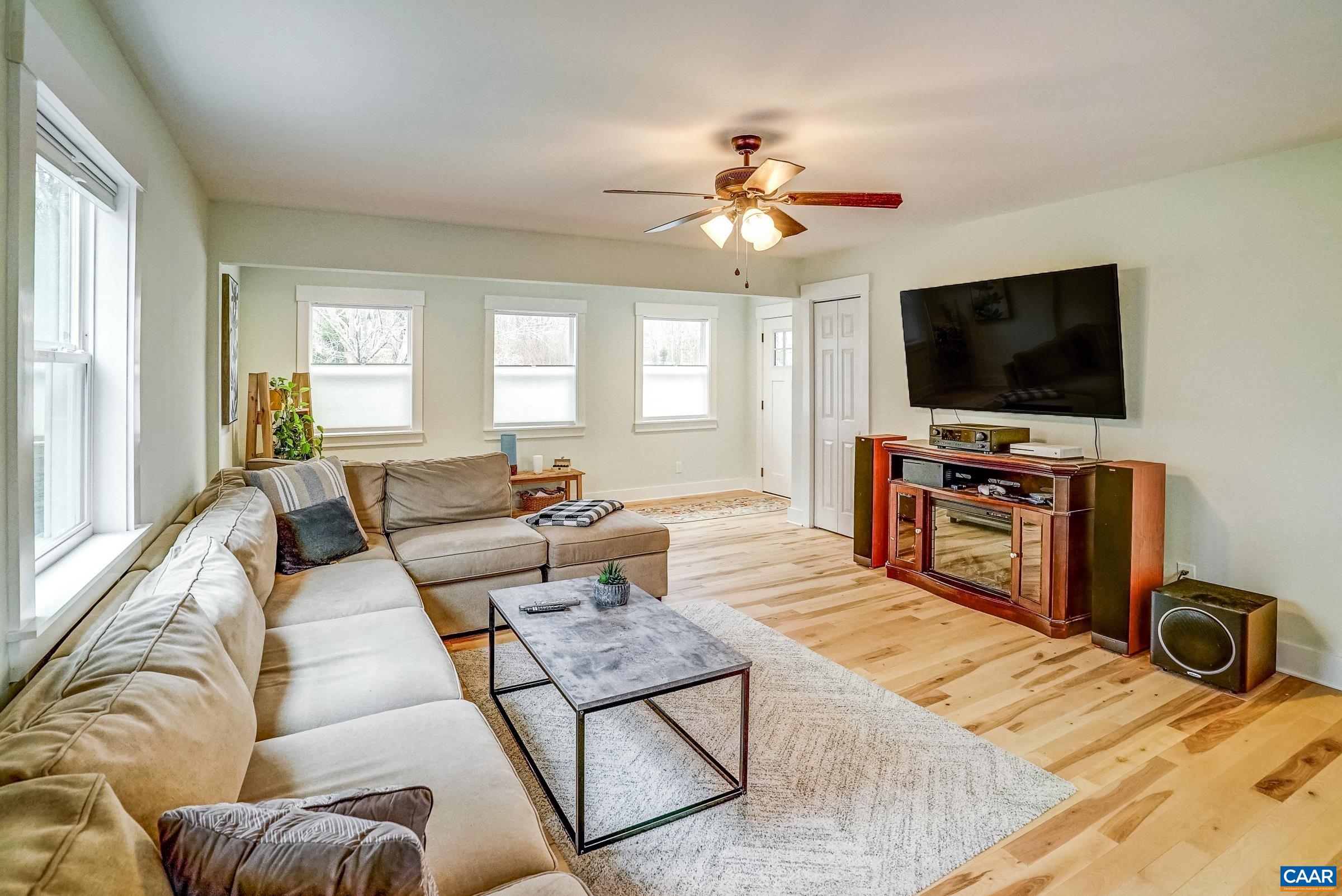 1265 Pounding Creek Road Charlottesville, VA 22903 - Photo 18 of 71 a living room with furniture and a flat screen tv