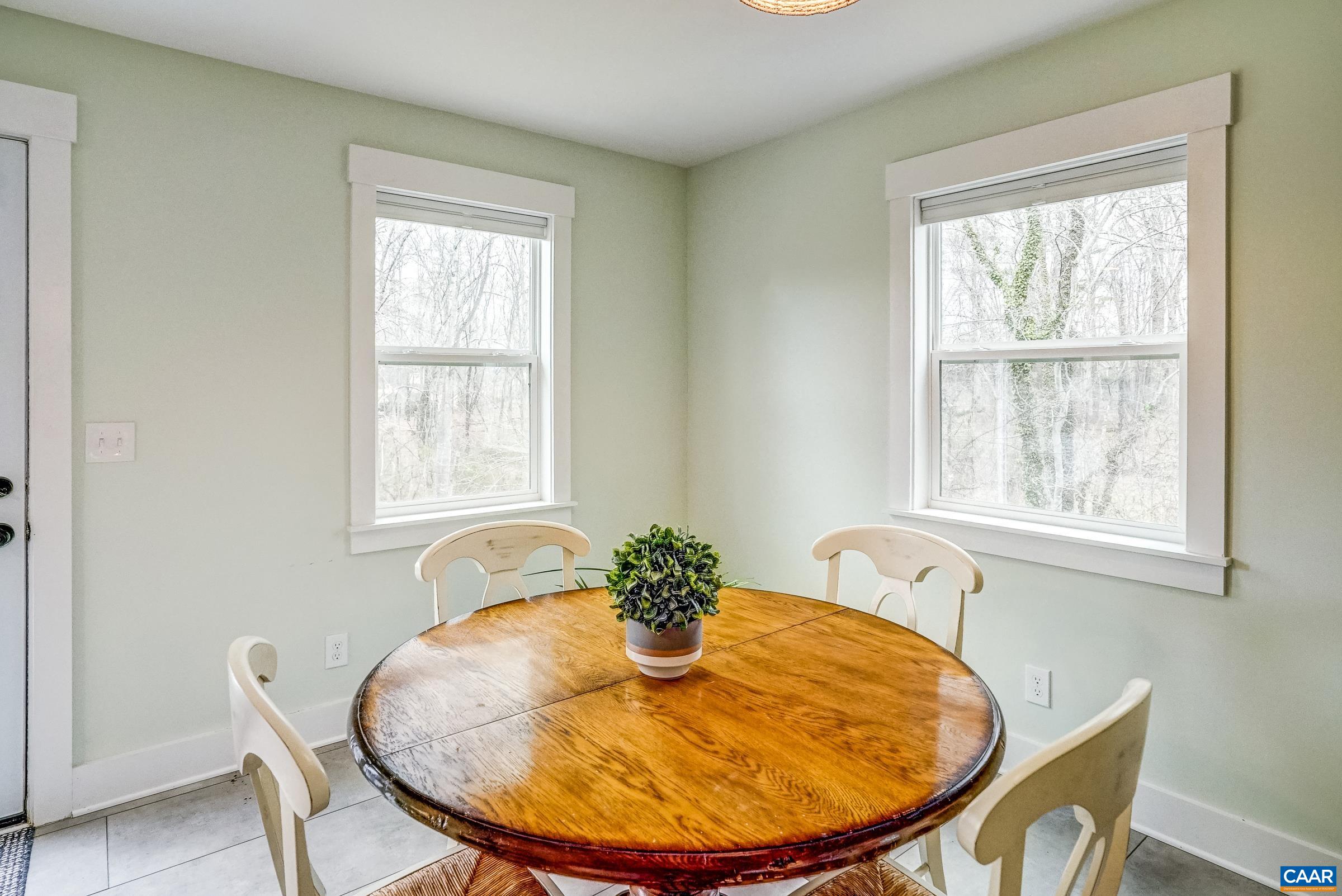 1265 Pounding Creek Road Charlottesville, VA 22903 - Photo 20 of 71 a view of a dining room with furniture and window