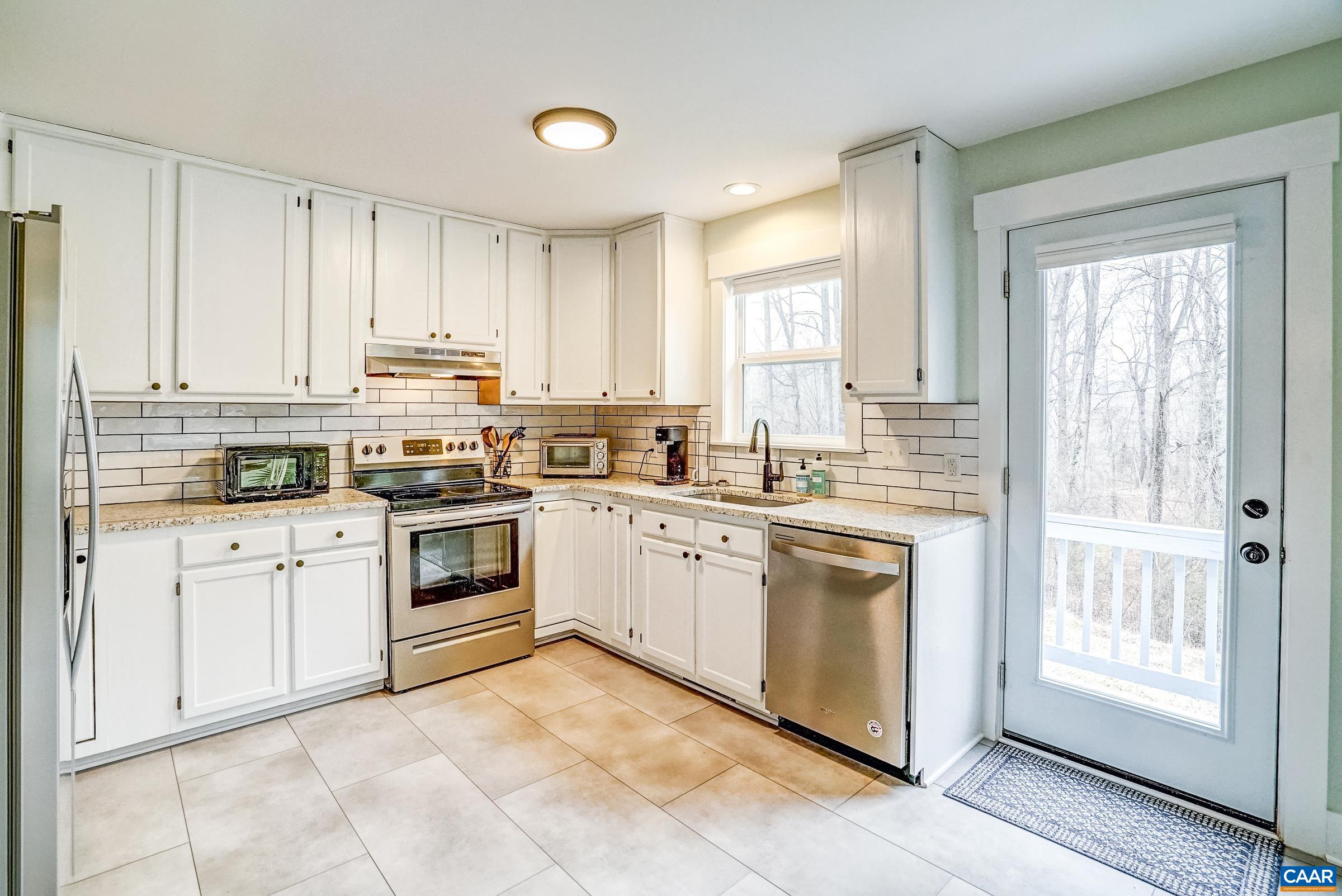 1265 Pounding Creek Road Charlottesville, VA 22903 - Photo 21 of 71 a kitchen with appliances cabinets and a sink