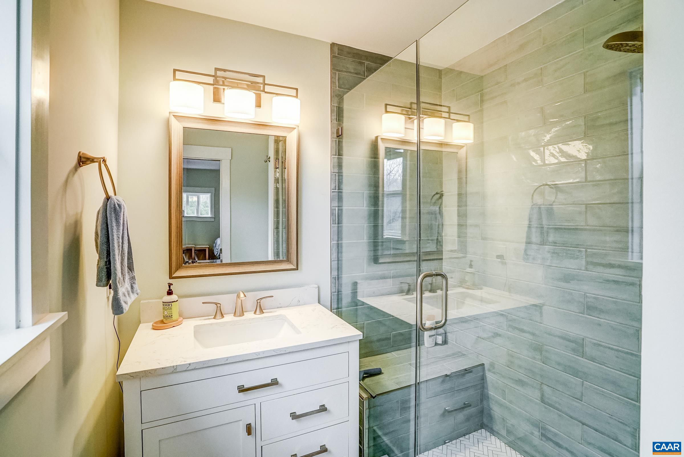 1265 Pounding Creek Road Charlottesville, VA 22903 - Photo 31 of 71 a bathroom with a sink and a mirror