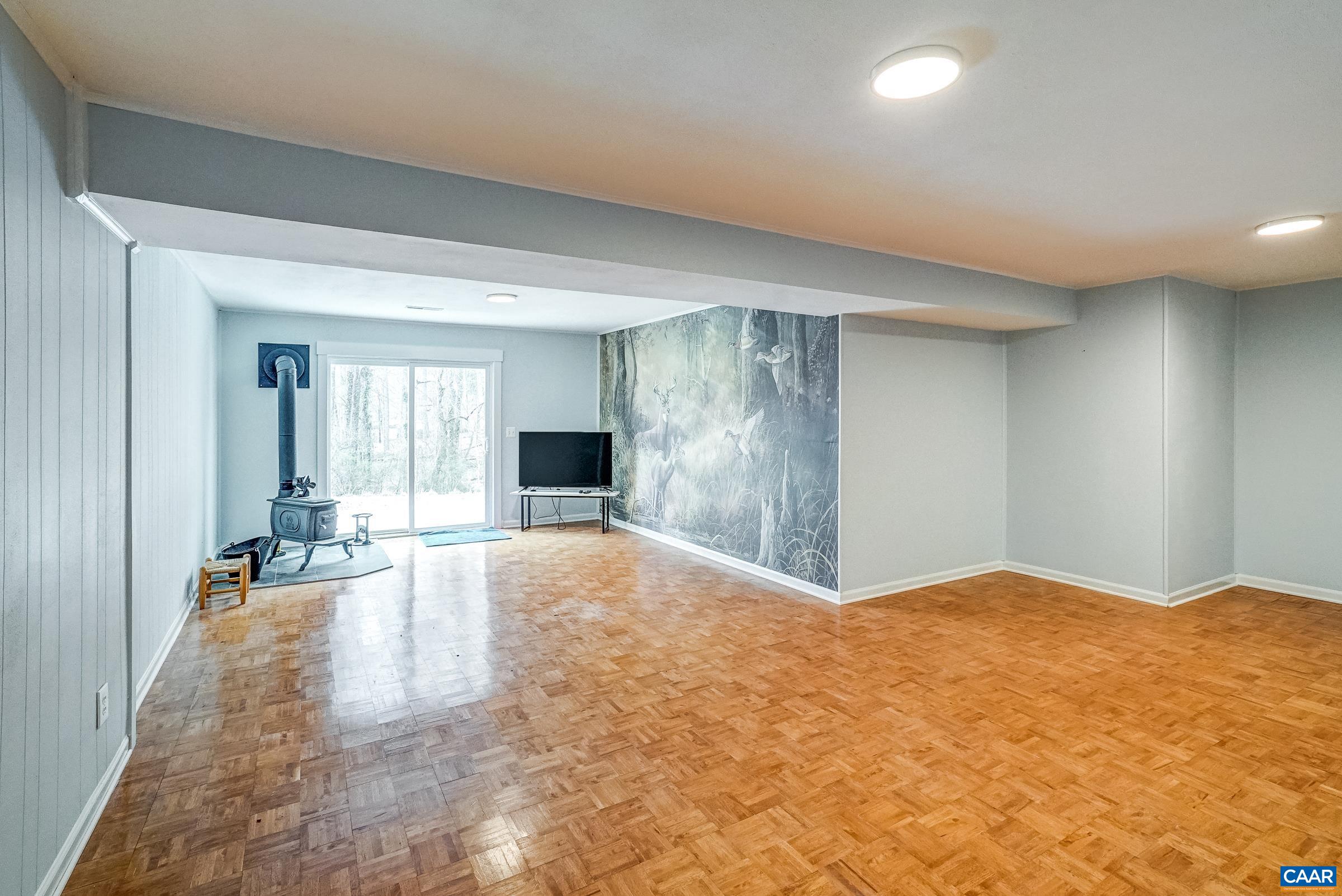 1265 Pounding Creek Road Charlottesville, VA 22903 - Photo 37 of 71 a view of a livingroom with a staircase