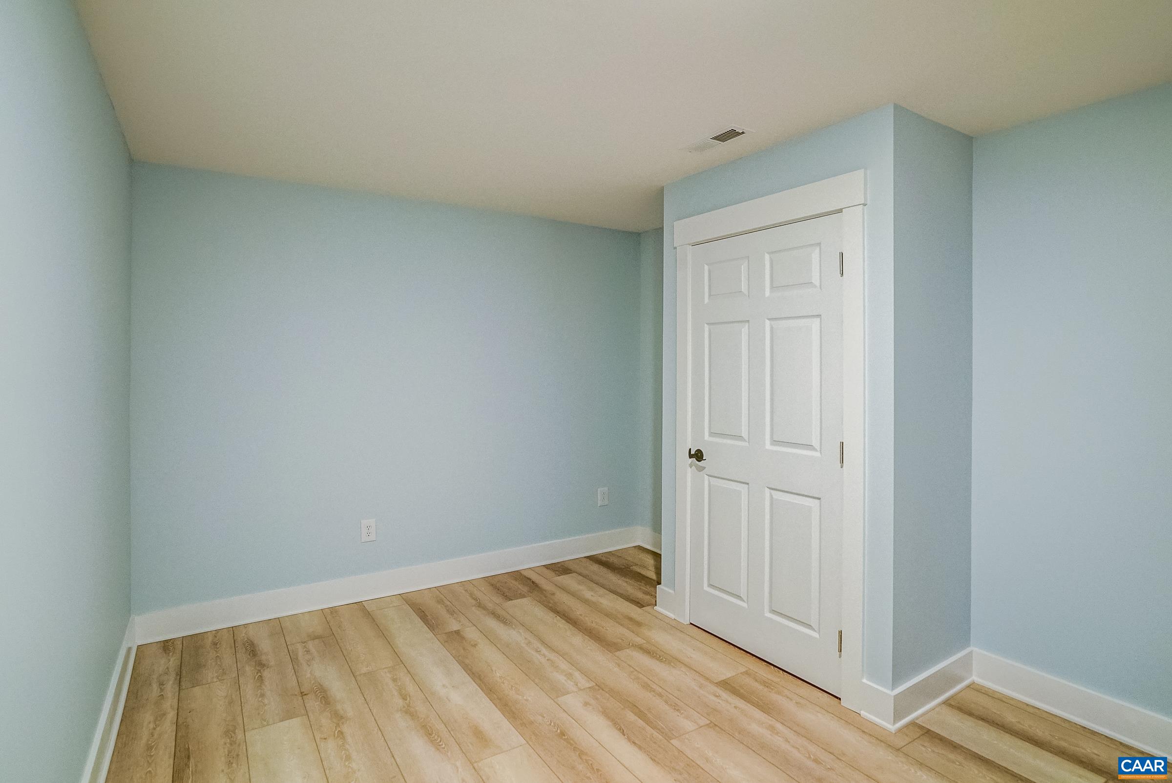 1265 Pounding Creek Road Charlottesville, VA 22903 - Photo 40 of 71 a view of a room with wooden floor and closet