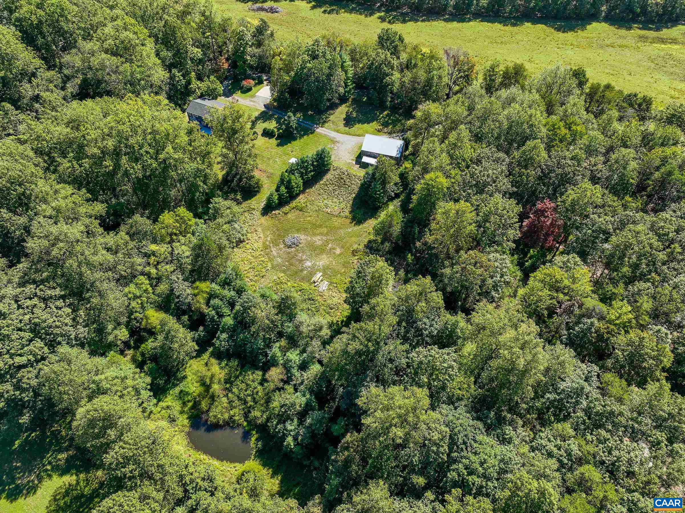 1265 Pounding Creek Road Charlottesville, VA 22903 - Photo 42 of 71 an aerial view of residential house with outdoor space and trees all around