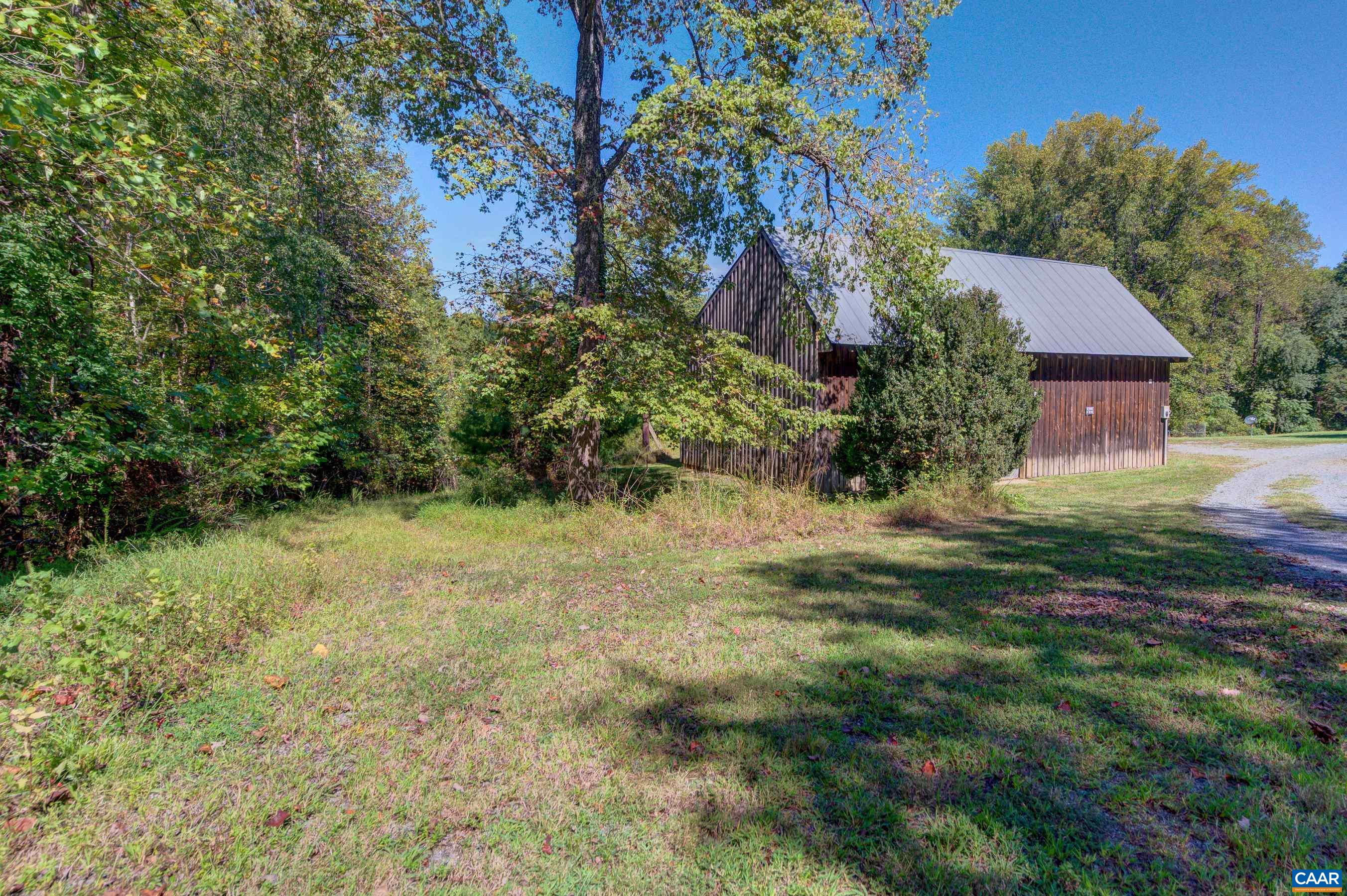 1265 Pounding Creek Road Charlottesville, VA 22903 - Photo 51 of 71 a view of a big yard with plants and large trees