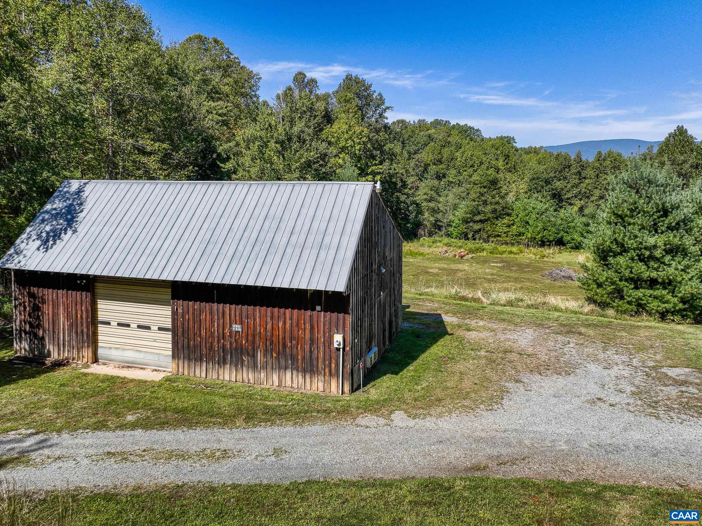 1265 Pounding Creek Road Charlottesville, VA 22903 - Photo 57 of 71 a view of a back yard of the house