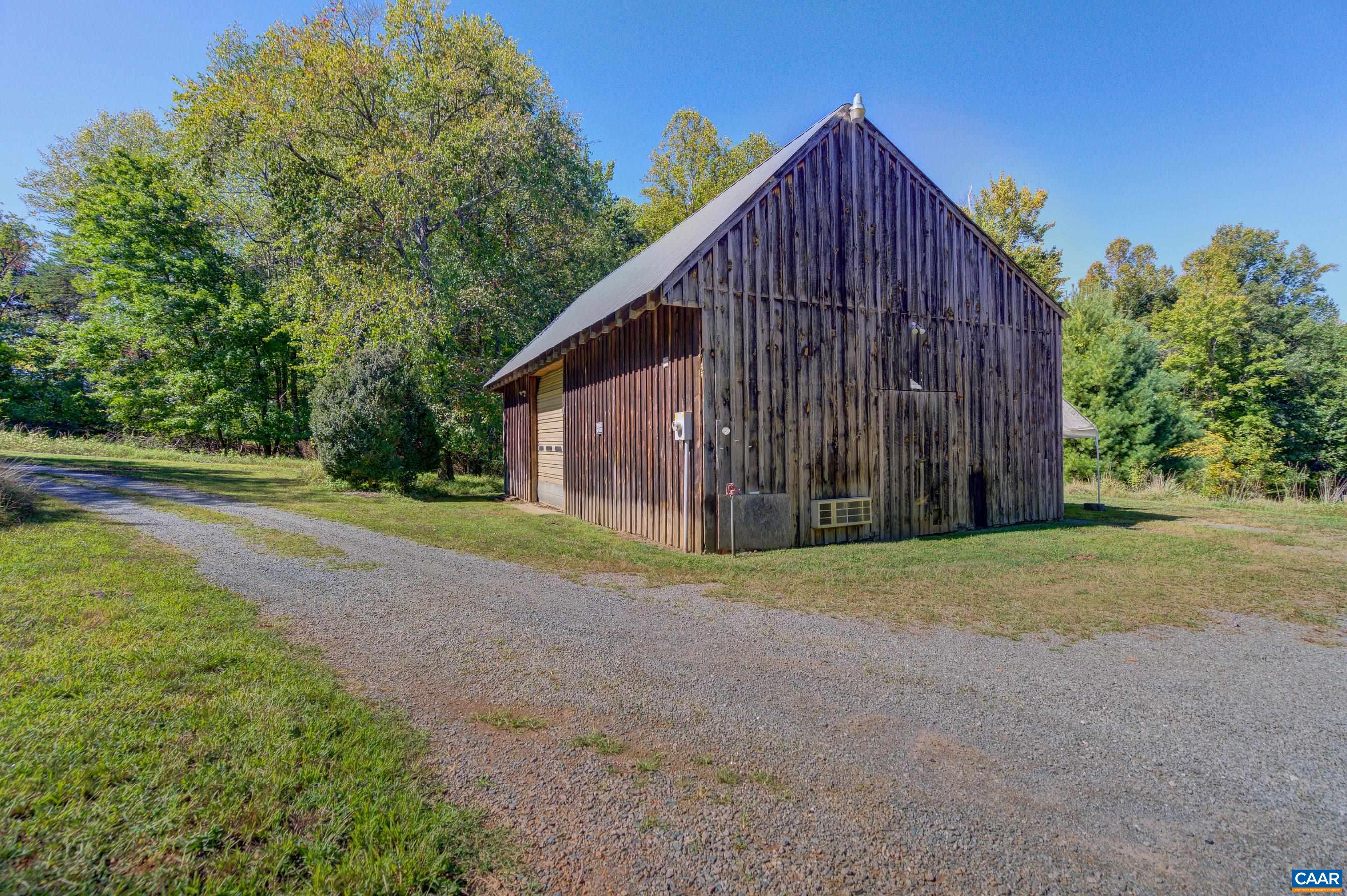1265 Pounding Creek Road Charlottesville, VA 22903 - Photo 58 of 71 a view of a house with backyard and trees