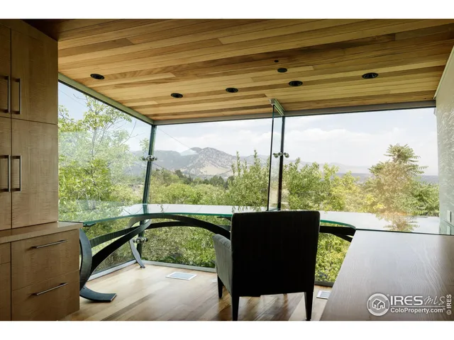 a view of a room with a bed