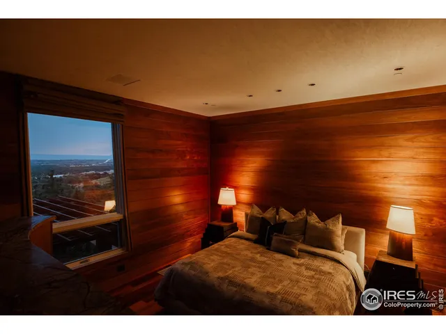 a view of a room with furniture and wooden floor