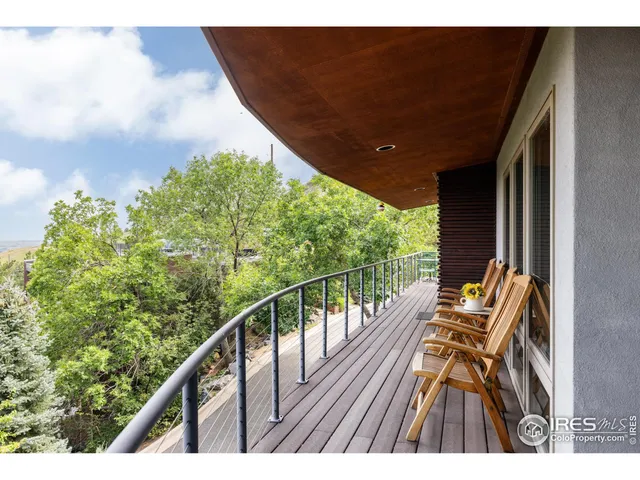 a view of balcony with furniture