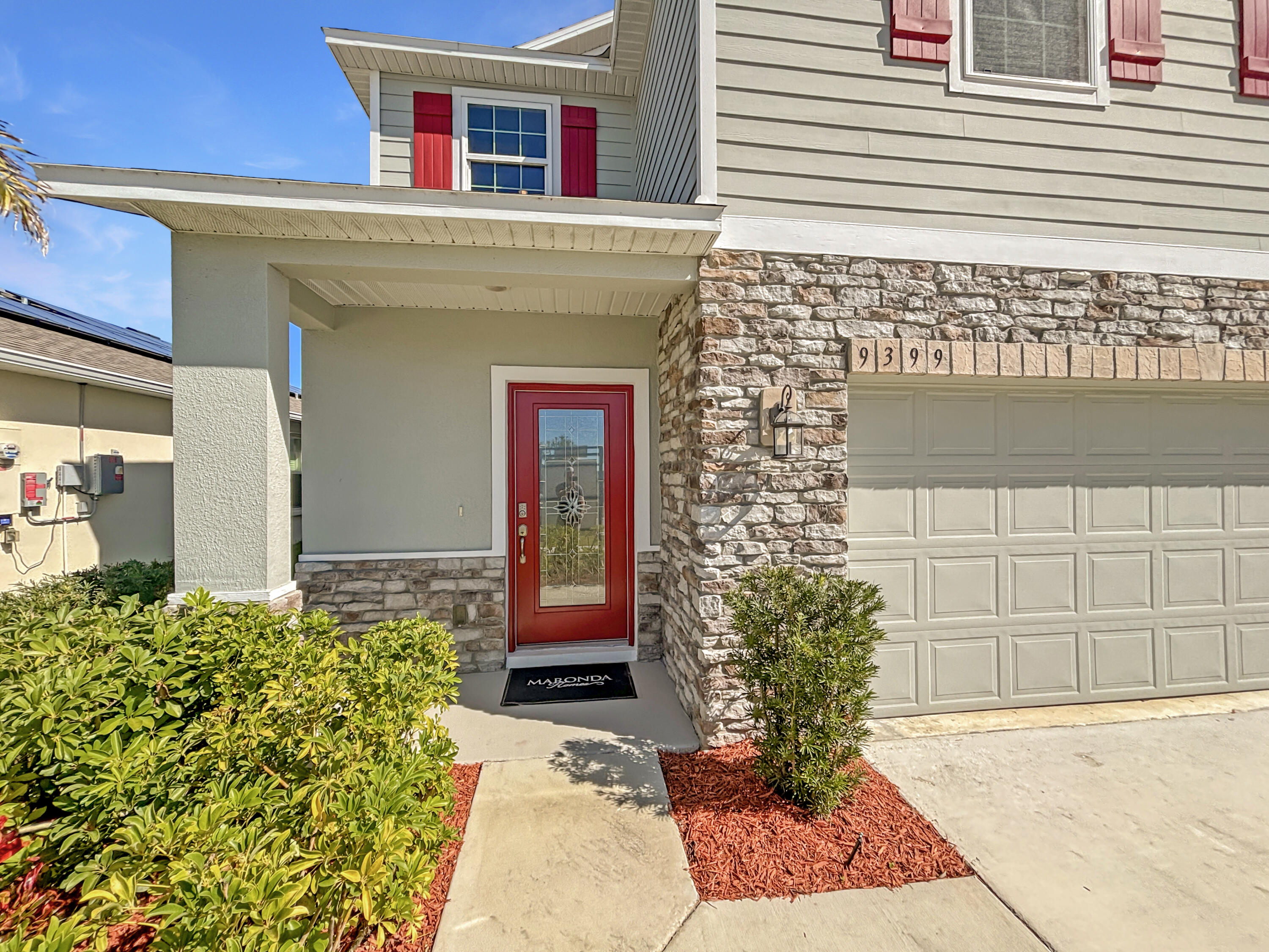 9399 Southwest Serapis Way Port Port St. Lucie, FL 34987 - Photo 2 of 43 a front view of a house