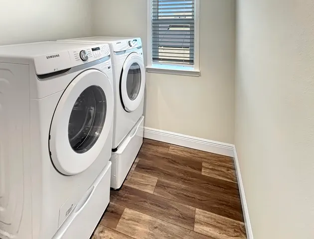 a utility room with dryer and washer