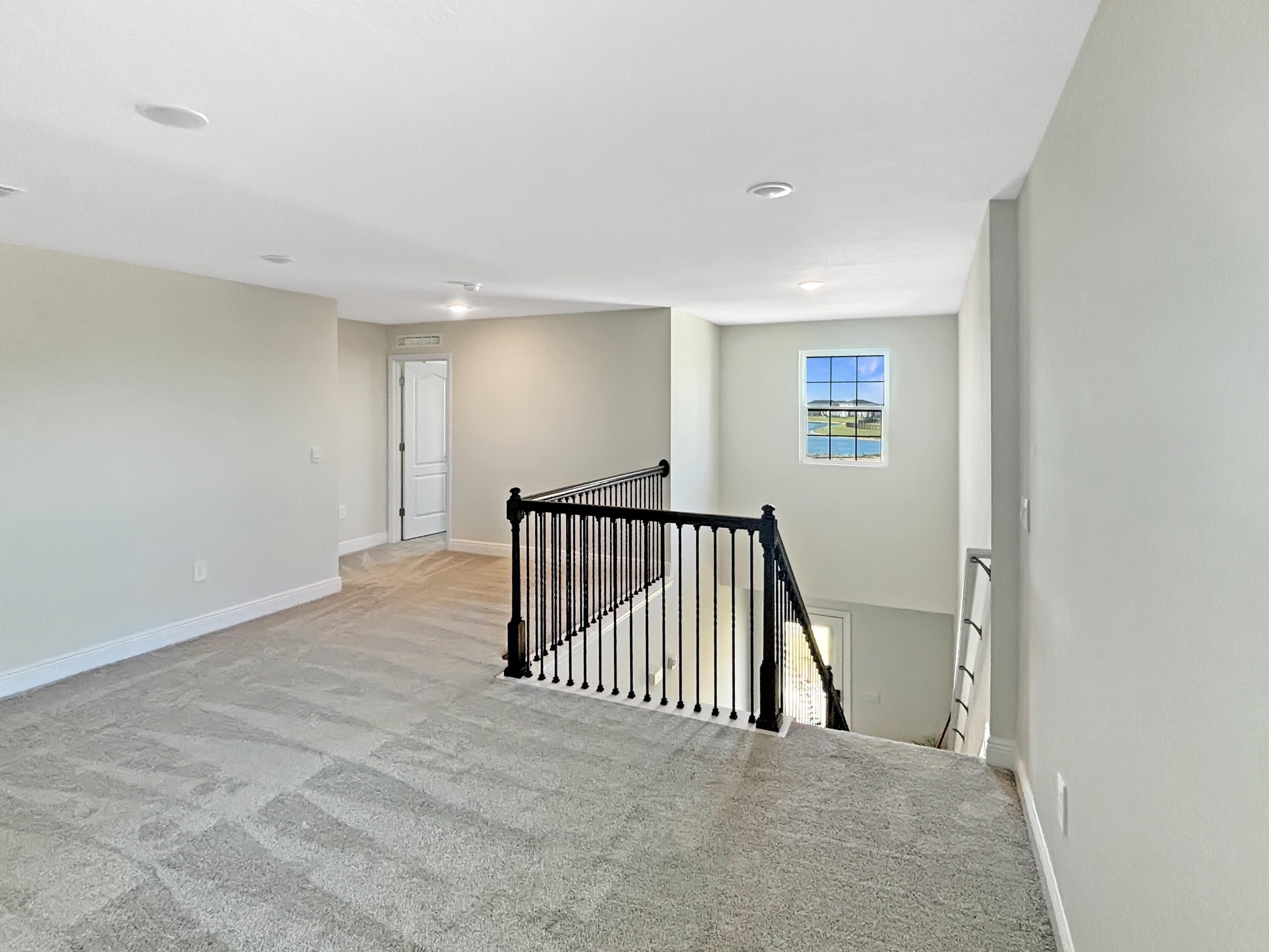 9399 Southwest Serapis Way Port Port St. Lucie, FL 34987 - Photo 33 of 43 a view of hallway with livingroom