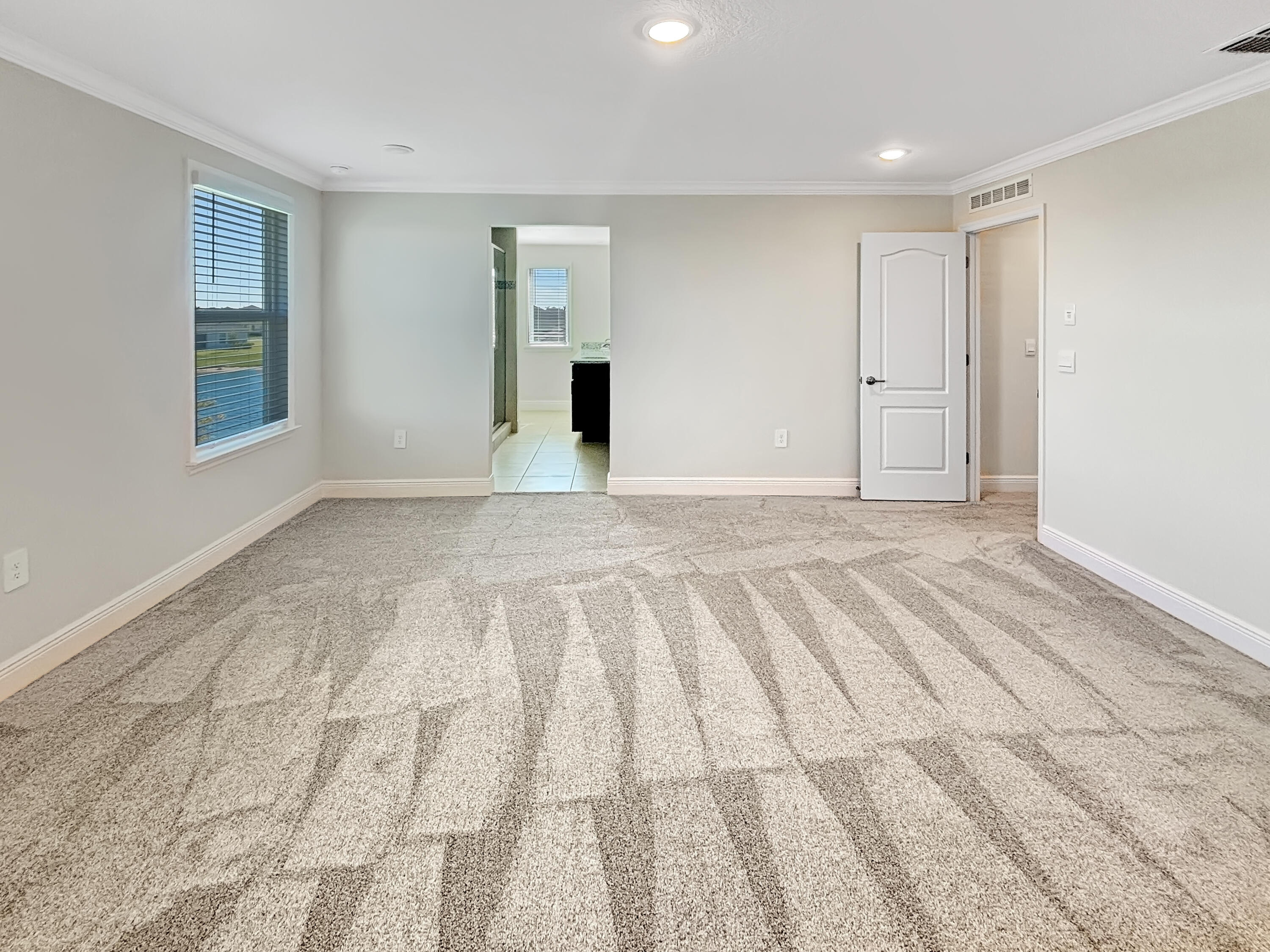 9399 Southwest Serapis Way Port Port St. Lucie, FL 34987 - Photo 36 of 43 a view of an empty room and window