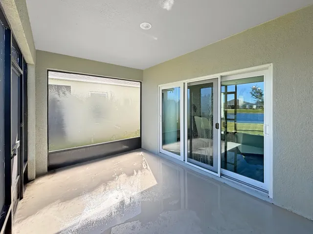 a front view of house with a garden and trees