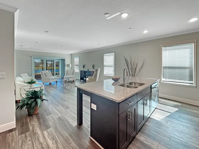 a kitchen with counter space and wooden floor