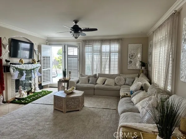 a living room with furniture and a large window