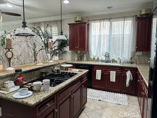 a kitchen with a stove and a sink