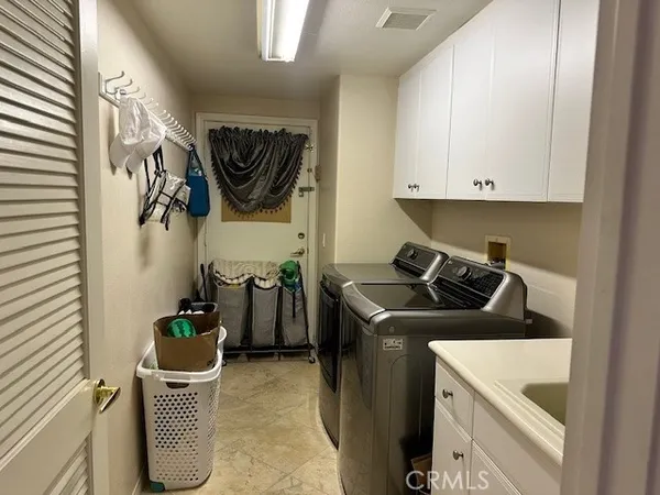 a kitchen with a stove and a refrigerator