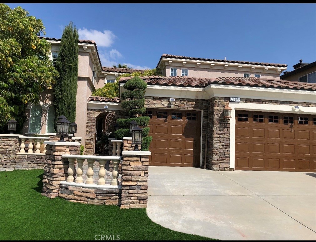 23422 Camino Terraza Road Corona, CA 92883 - Photo 3 of 47 a view of a house with a garden
