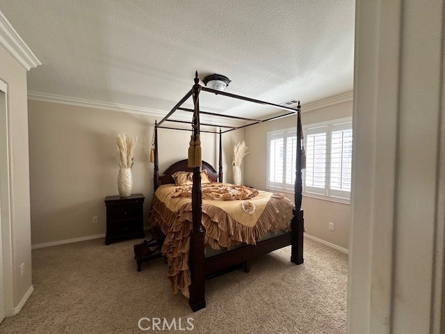 23422 Camino Terraza Road Corona, CA 92883 - Photo 39 of 47 a bedroom with a bed a window and closet