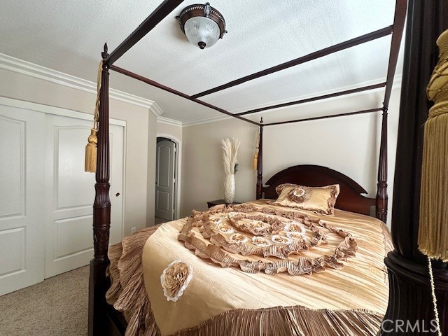 23422 Camino Terraza Road Corona, CA 92883 - Photo 40 of 47 a bedroom with a bed and a mirror